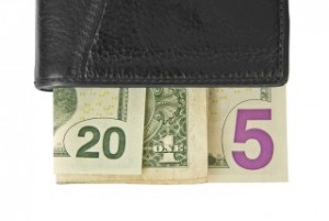 Dollar bills 2015 written in a wallet 523997623